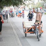 Pedi cab cyclist having fun with his job