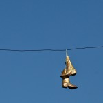 Bedazzled boots on a telephone wire