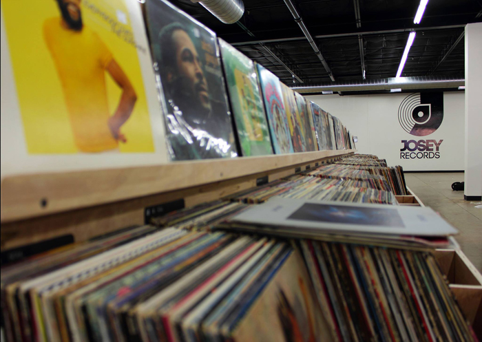 A row of record racks, full of vinyl albums