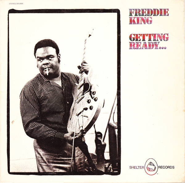 Album cover with man holding guitar