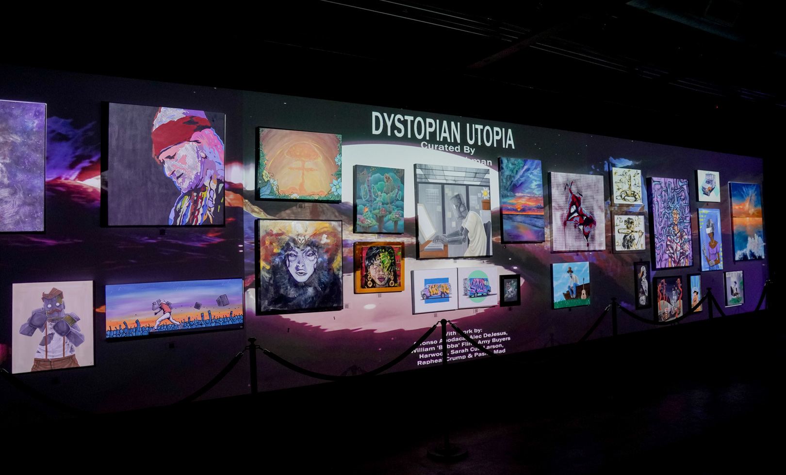 An art gallery wall lit by a projector