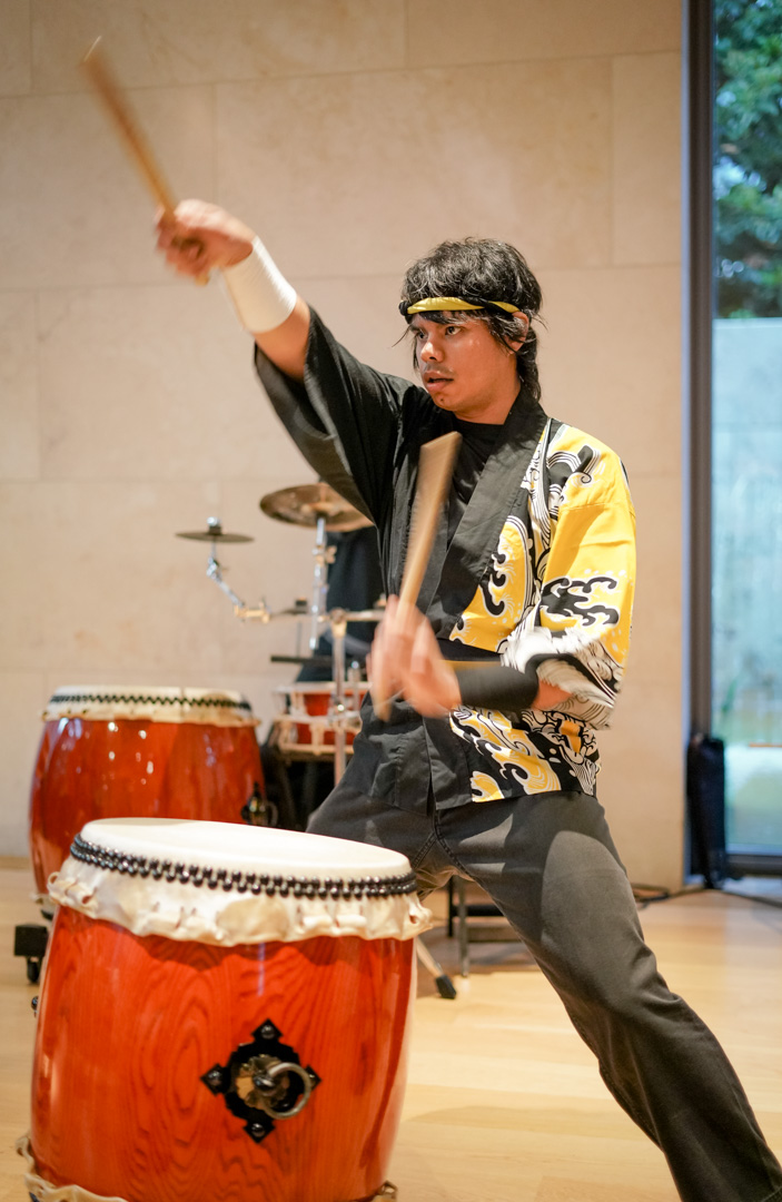 A young man plays a chu daiko drum