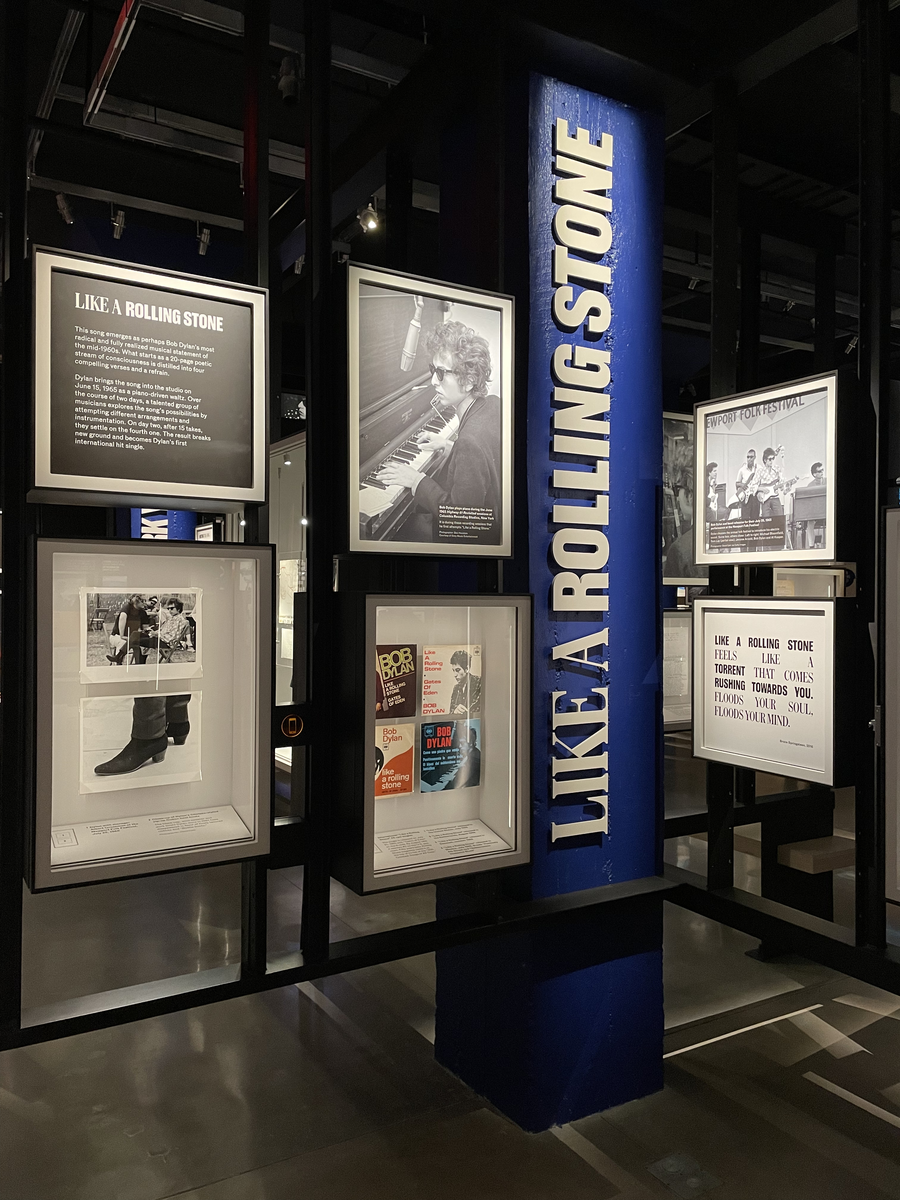 A display of photos and text about the song "Like a Rolling Stone"