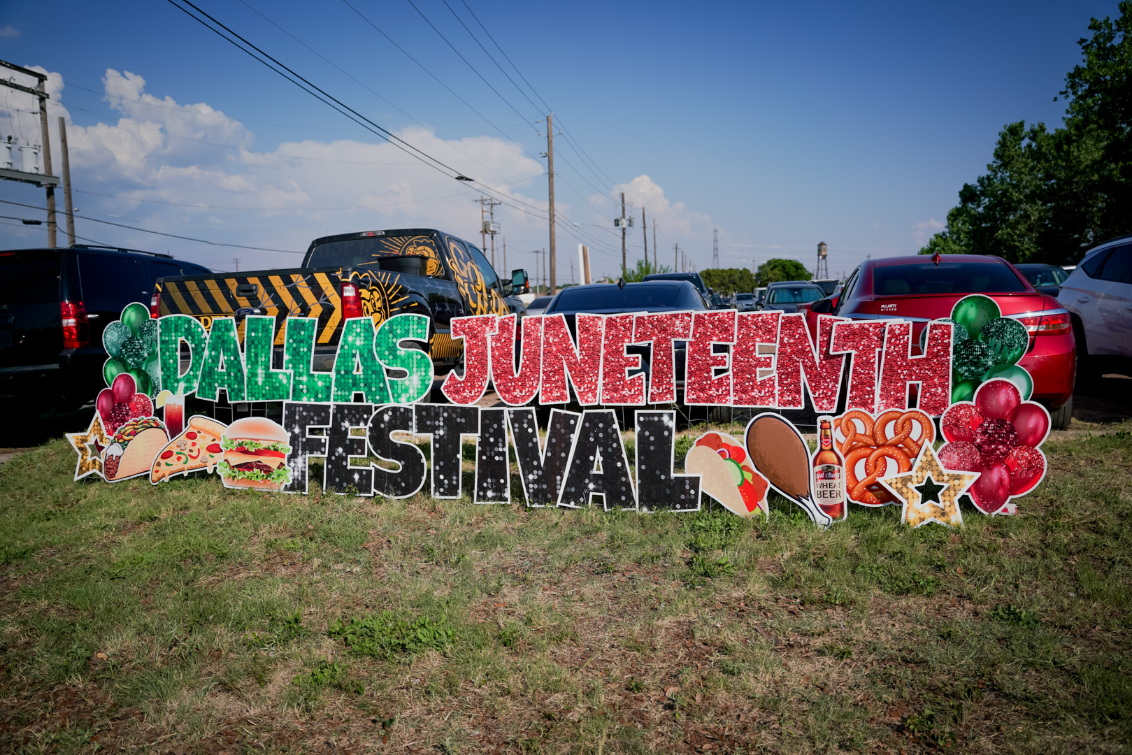 A large decorative sign that says Dallas Juneteenth Festival