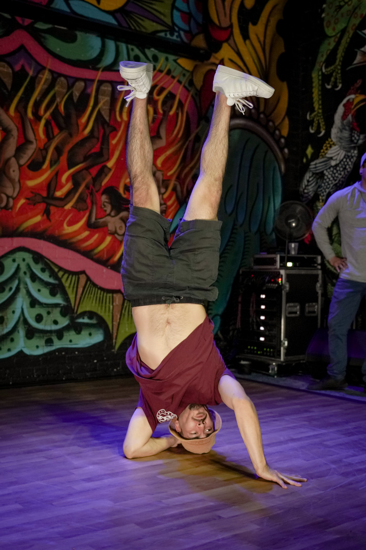 A dancer in a full headstand