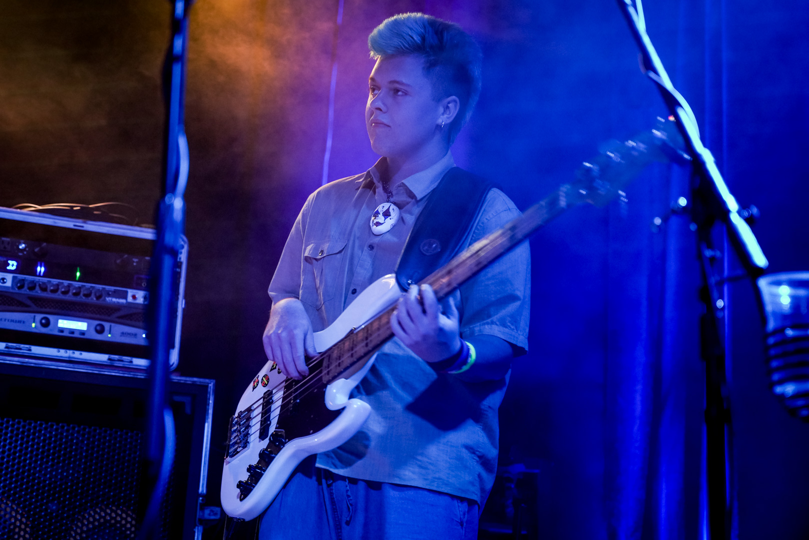 A young bass player on stage