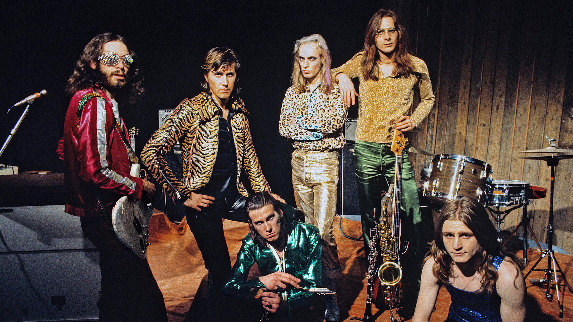 The members of Roxy Music face the camera