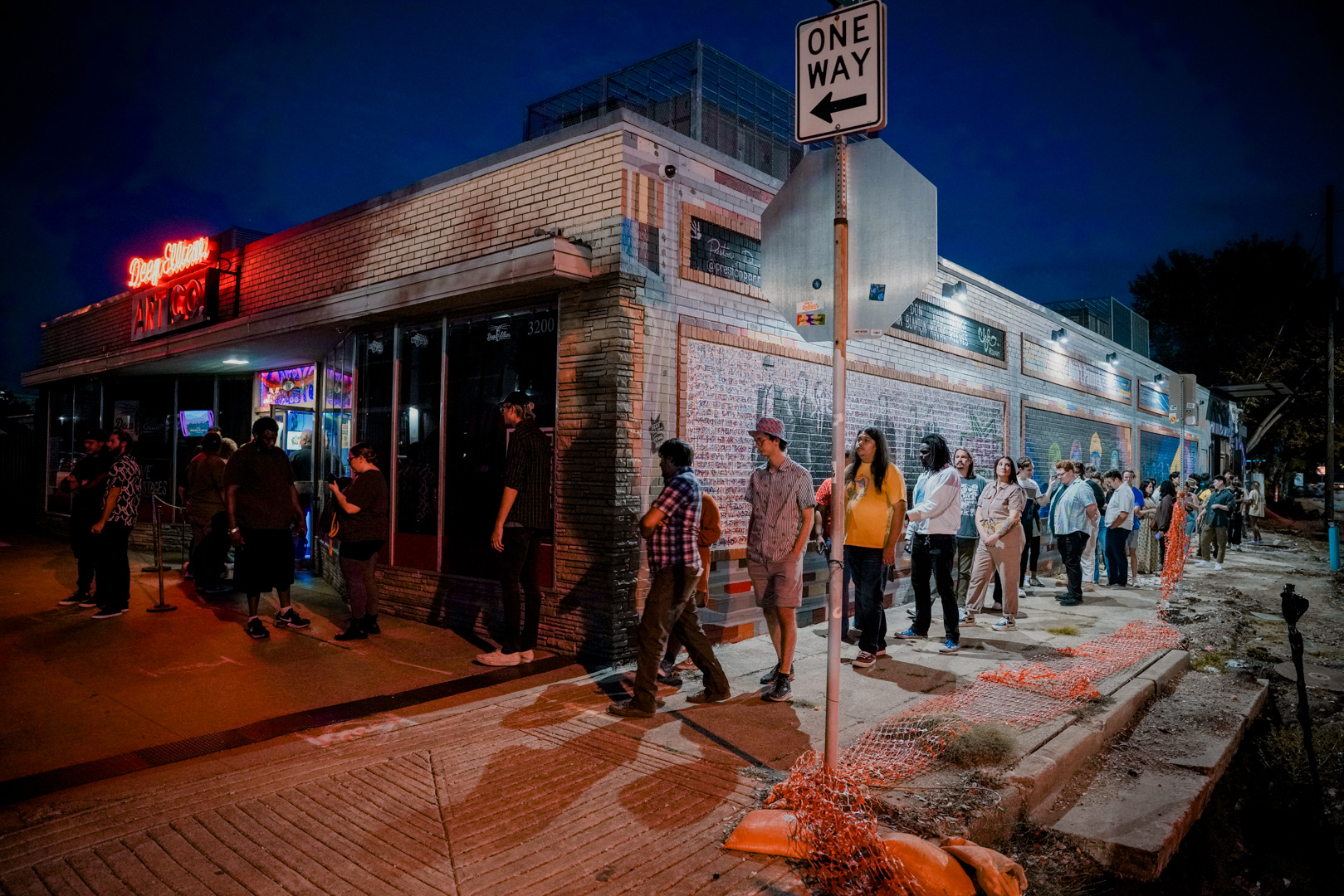 A line of people outside a music venue
