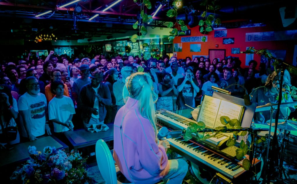 A full crowd in front of a stage