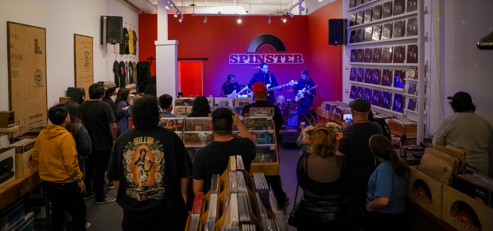 A band on stage inside a record shop