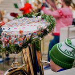 A tuba decorated with christmas decorations