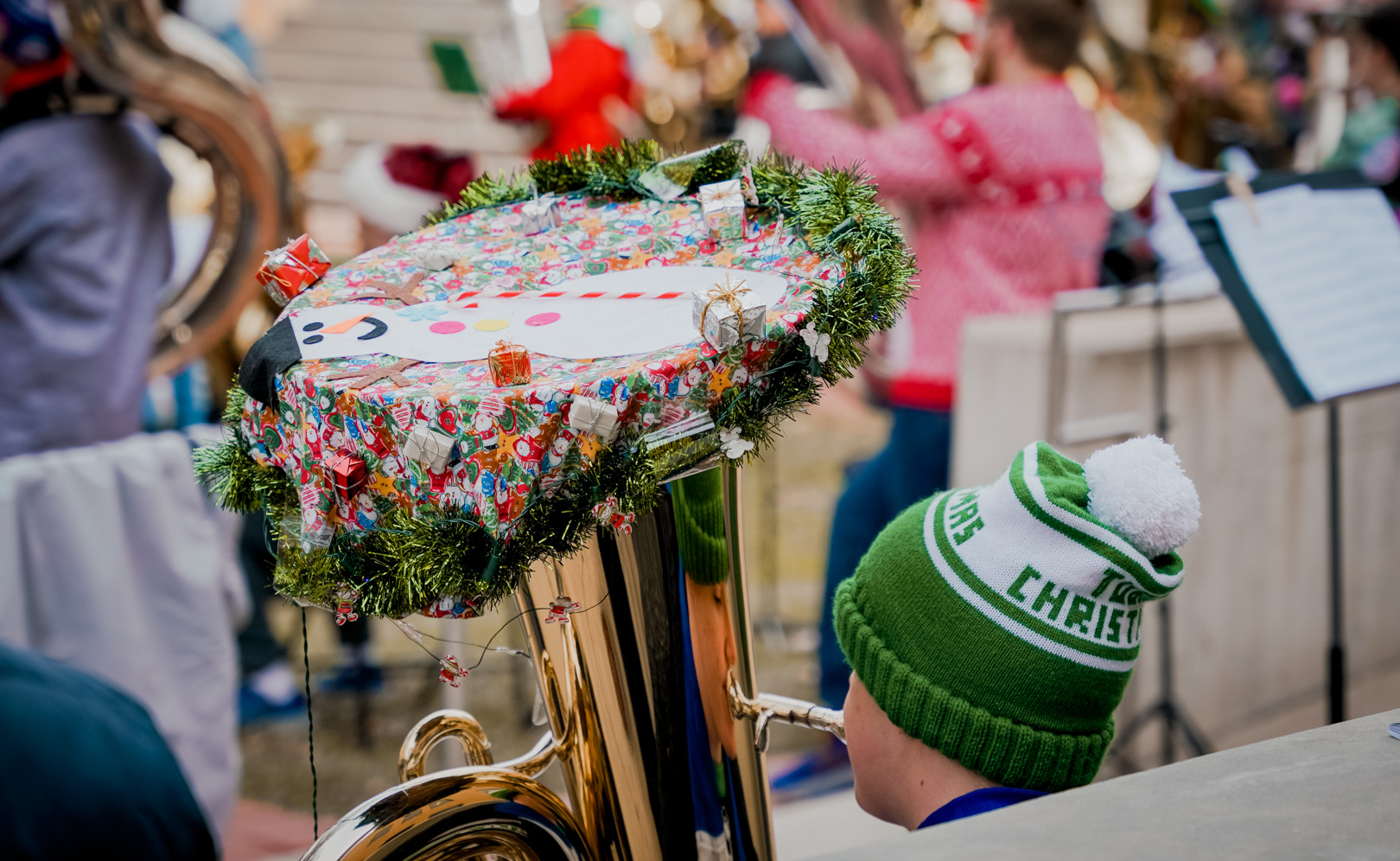 A tuba decorated with christmas decorations