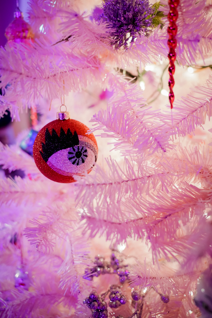 A with and pinkChristmas tree with an ornament of an eyeball