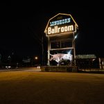 The sign of the Longhorn Ballroom lit up at night.
