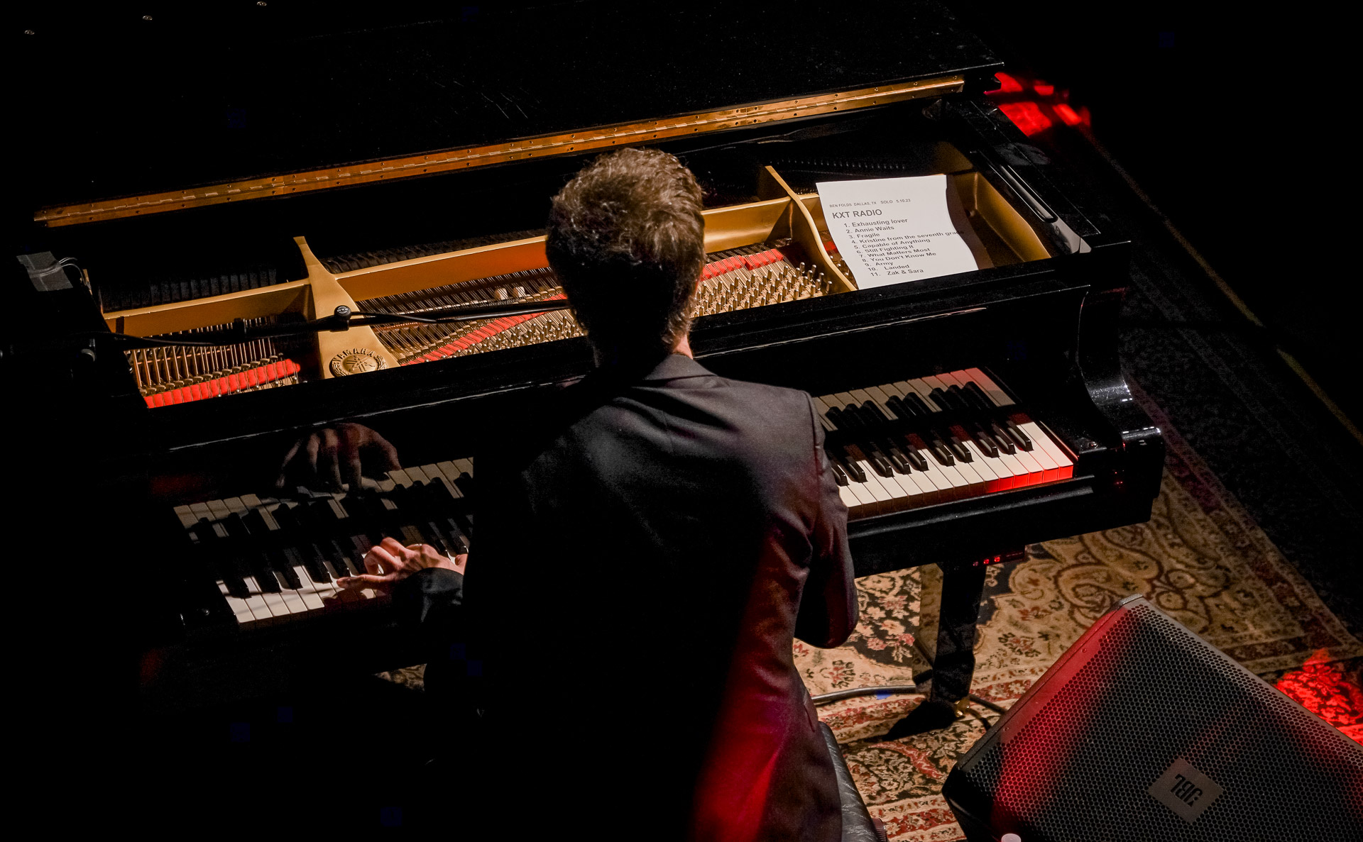 A man playing piano on stage
