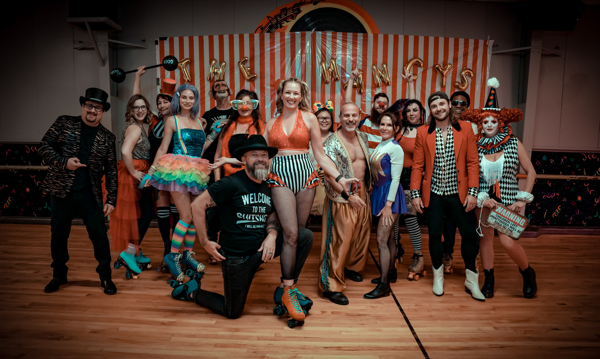 A group of people dressed in circus attire