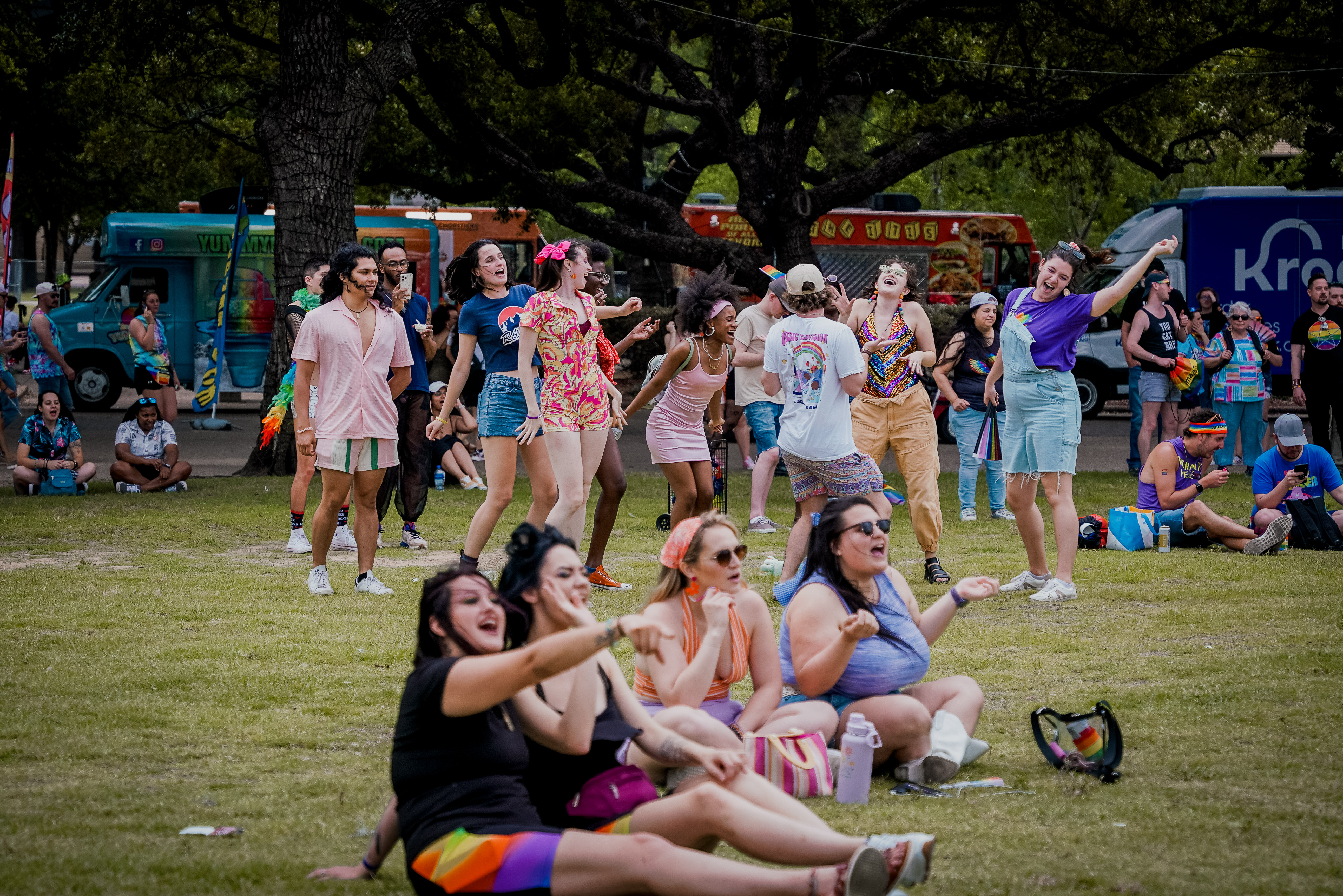 A group of people dancing on grass