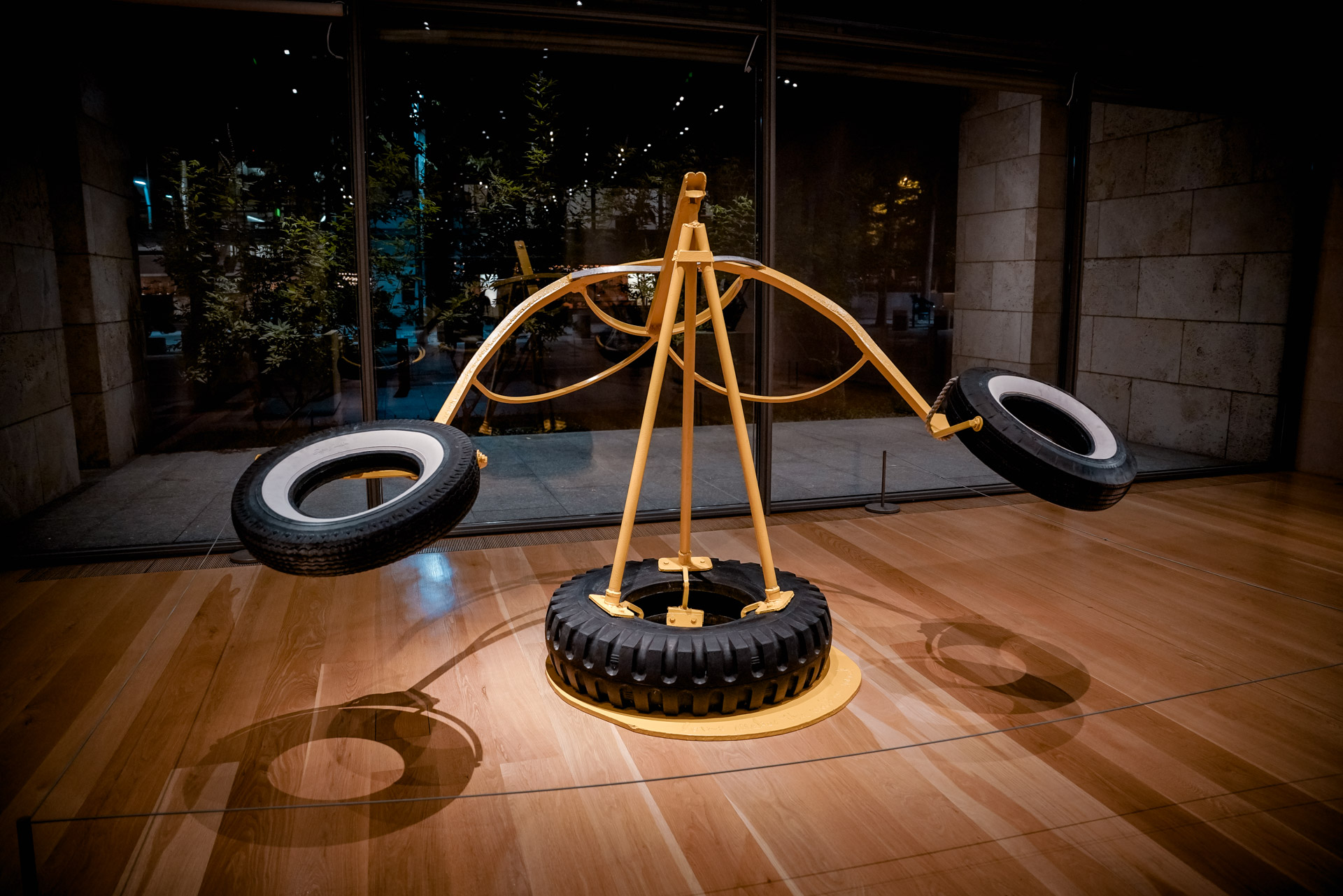 A large sculpture with tires on each side