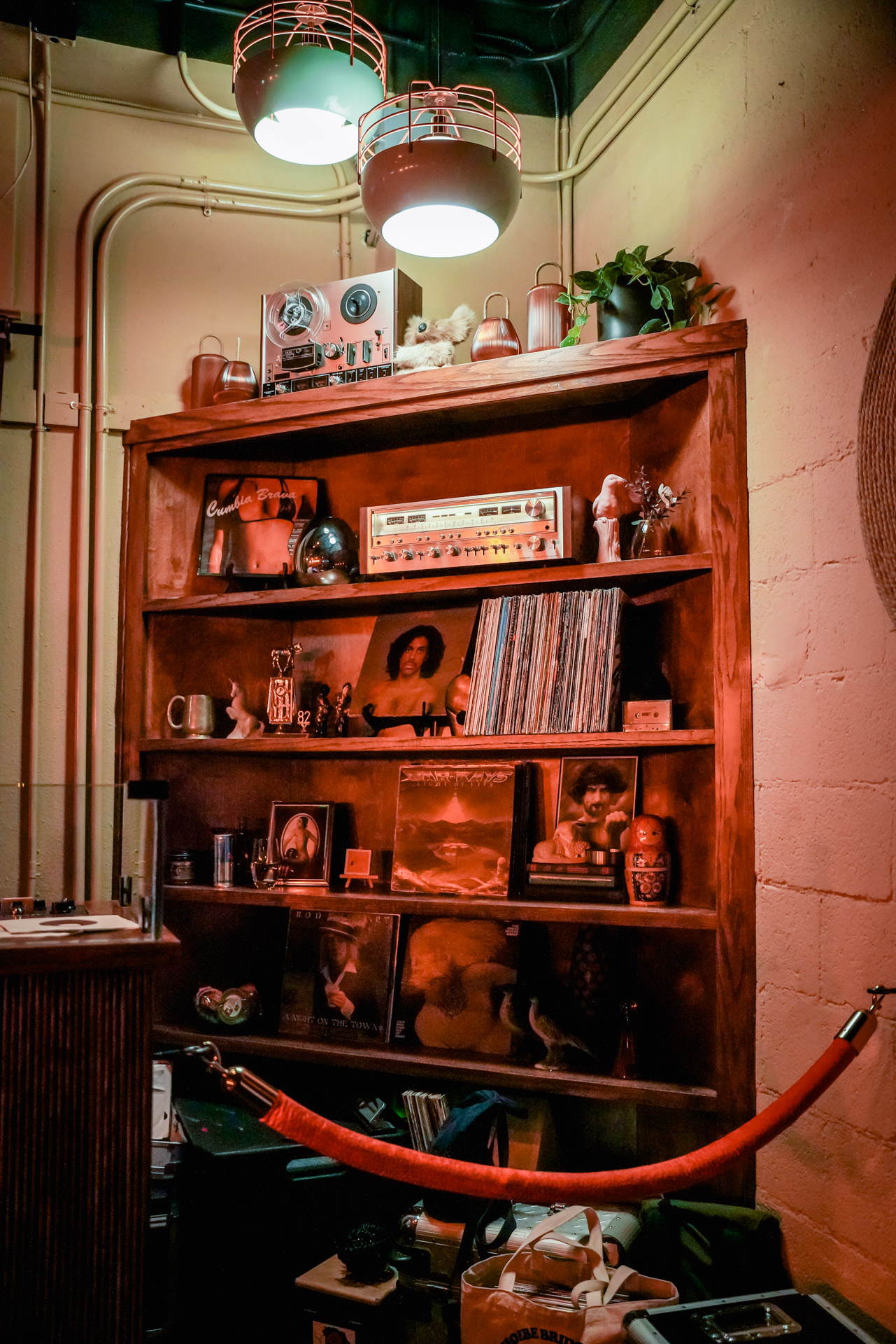 A shelf with vinyl records and trinkets