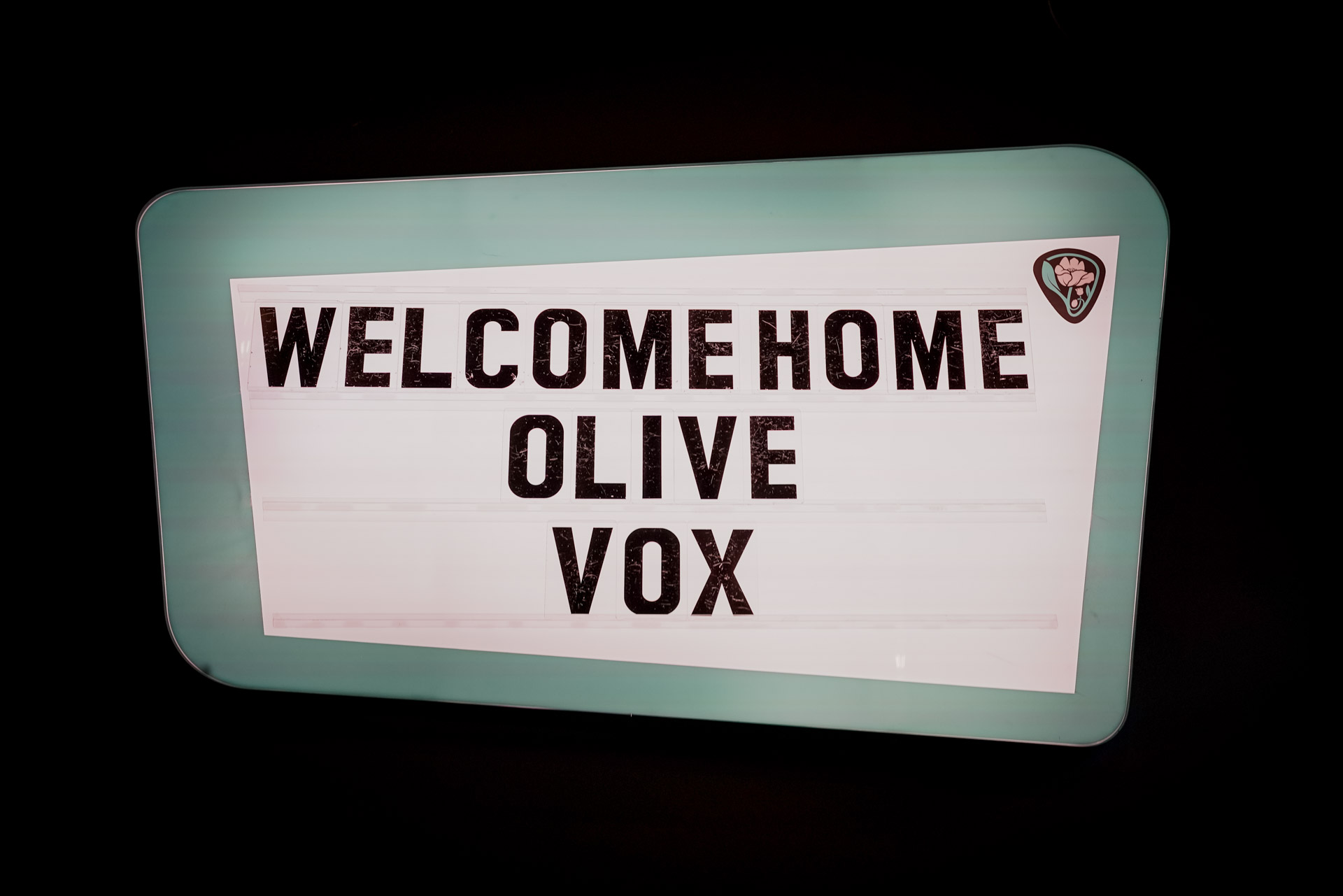 A marquee that says "WELCOME HOME OLIVE VOX"