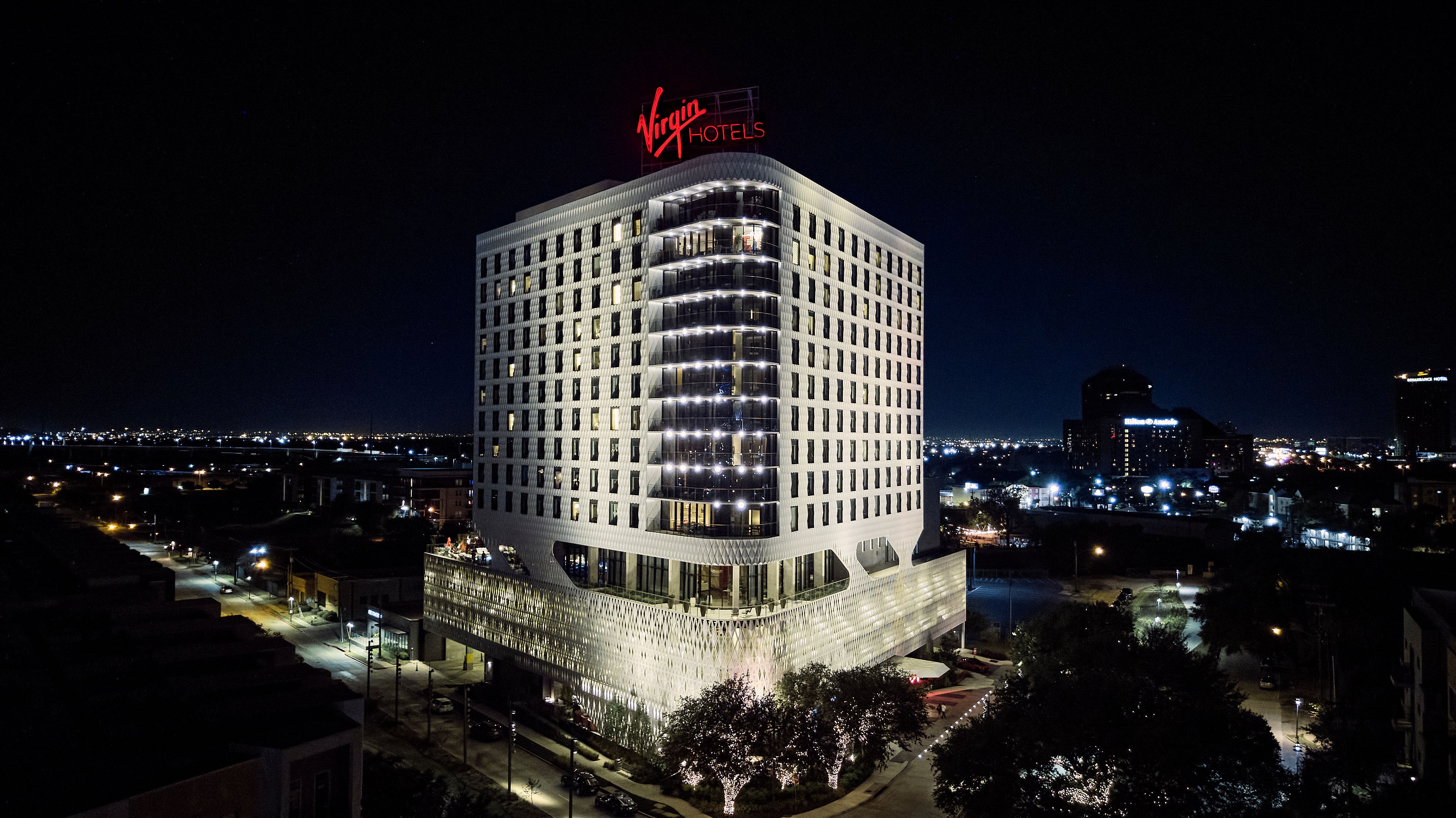 A wide shot of the outside of the Virgin Hotels Dallas