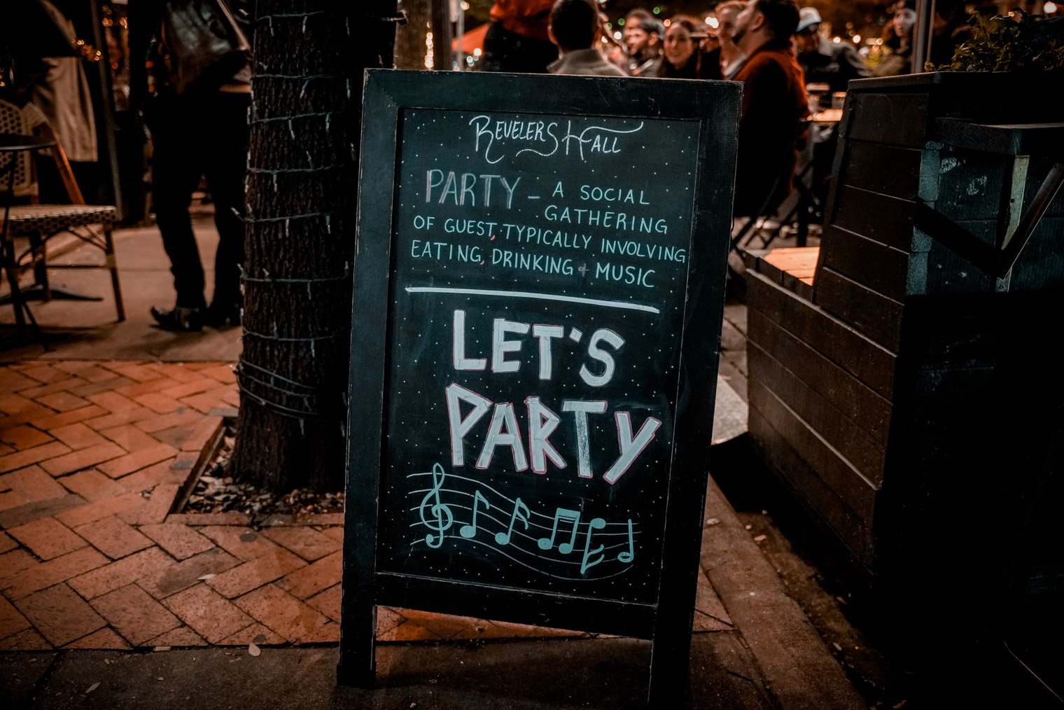 A sign that says "Let's Party"