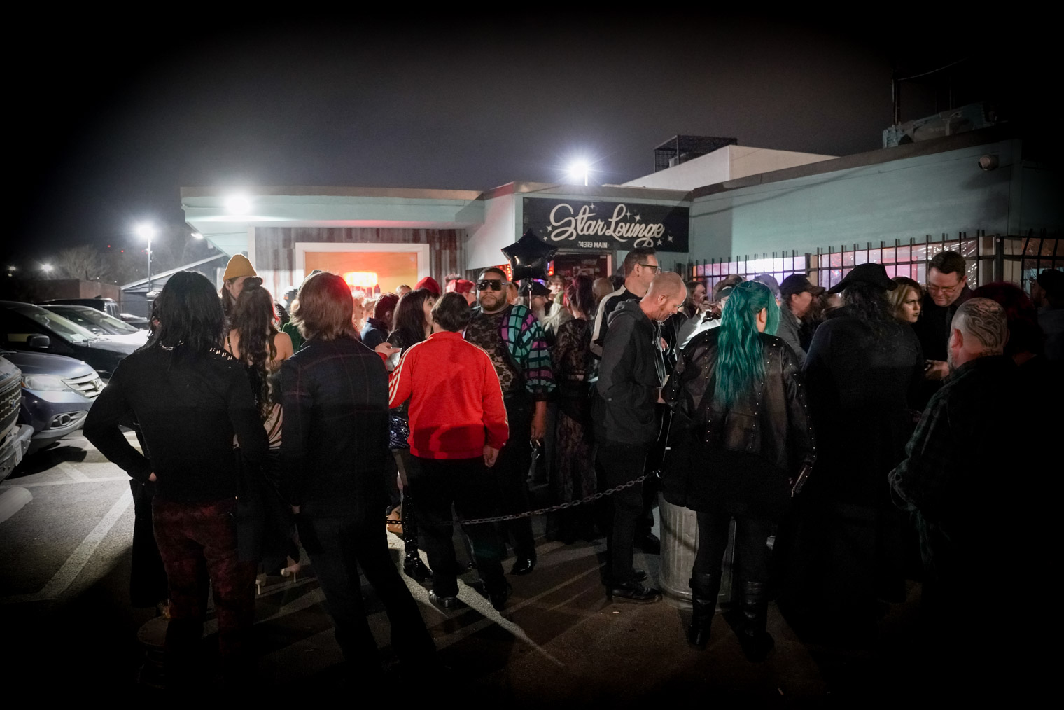 A crowd of people outside a venue