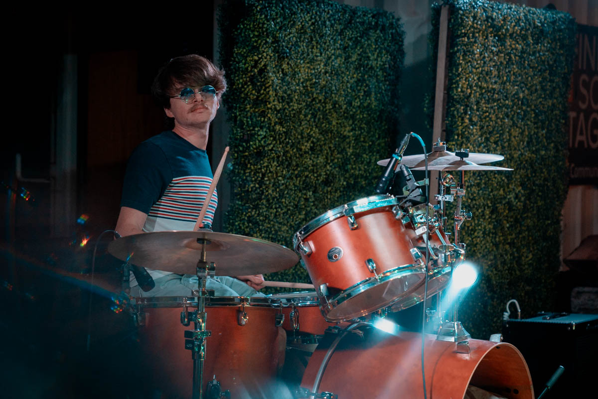 A musician playing drums on stage
