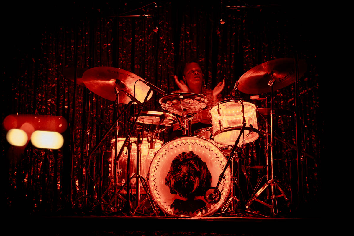A musician on stage playing drums