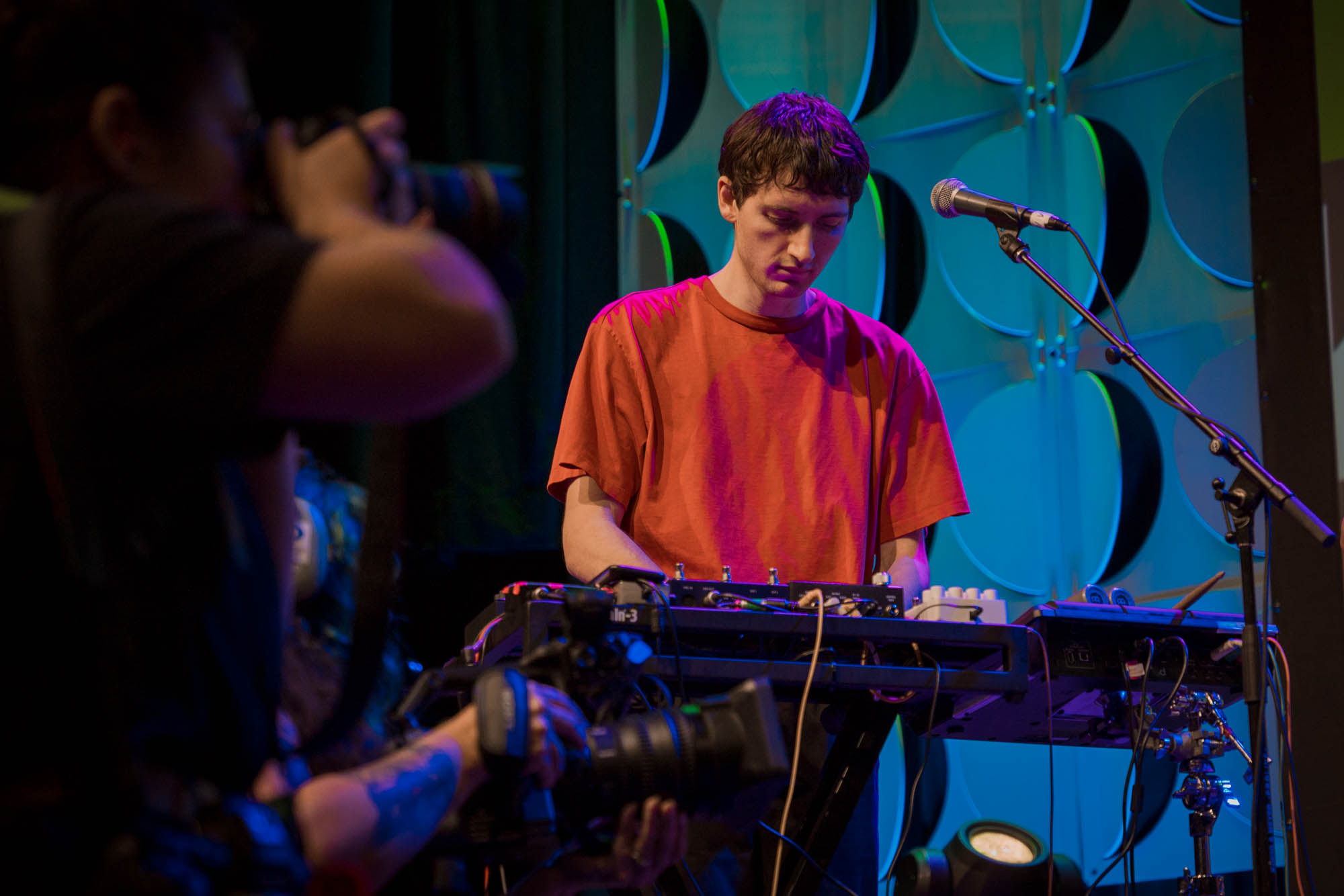 A musician playing keys on stage
