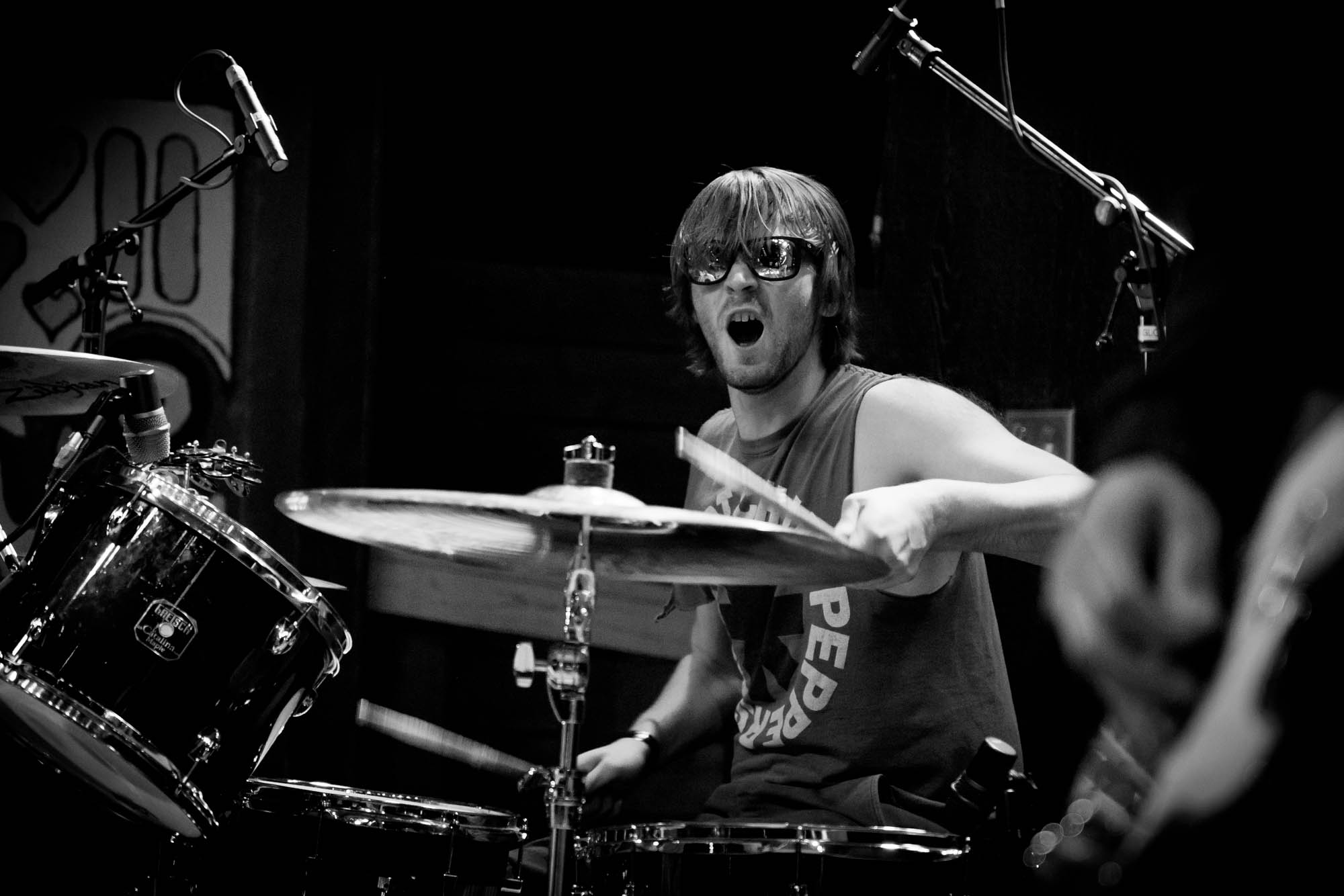 A musician playing drums on stage