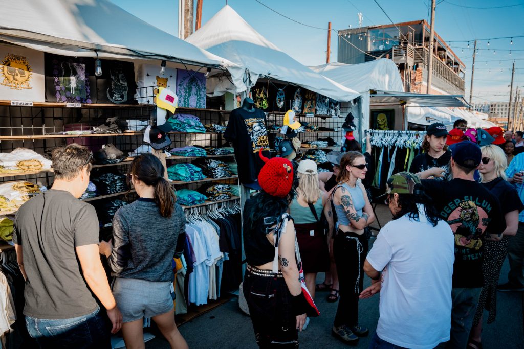 A crowd at a merchandise booth